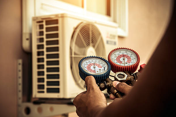 Professional Air Conditioning Service technician working in Lawtons, NY